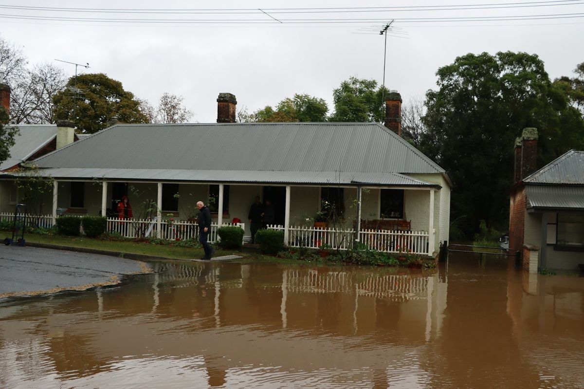 Floodwater sitting up against a house after a storm
